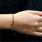 Rose Gold Italian Sterling Silver Adjustable "Love" Bracelet On Wrist