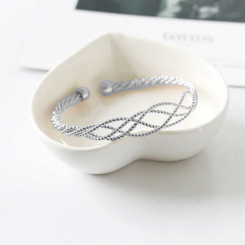 Sterling Silver Intertwined Diamond Cut Cuff Bangle