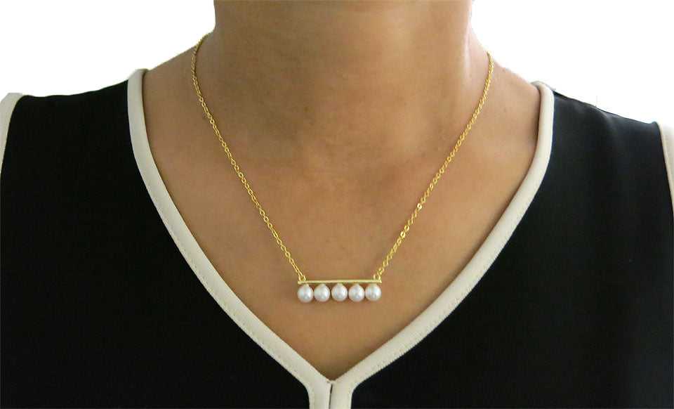 Gold Pearl Bar Necklace On Neck