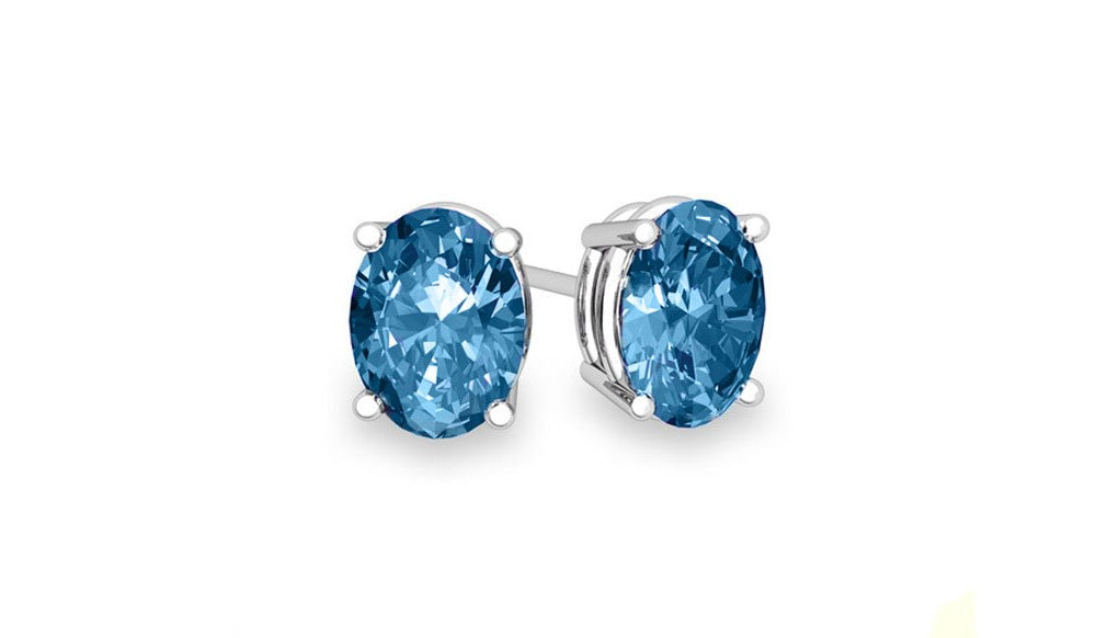 Sterling Silver Blue Topaz Oval Cut Studs