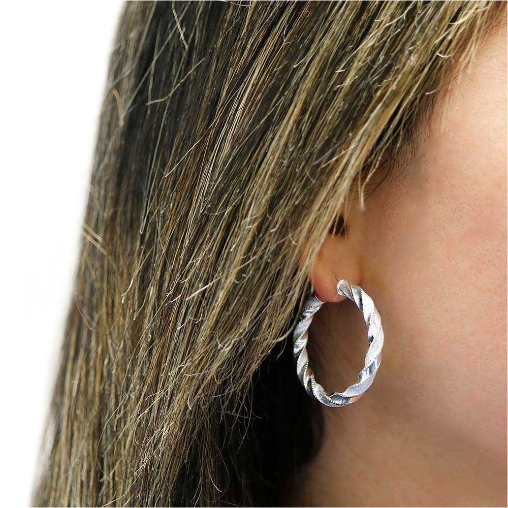 Silver Sterling Silver Diamond Cut Twisted Hoops On Ear