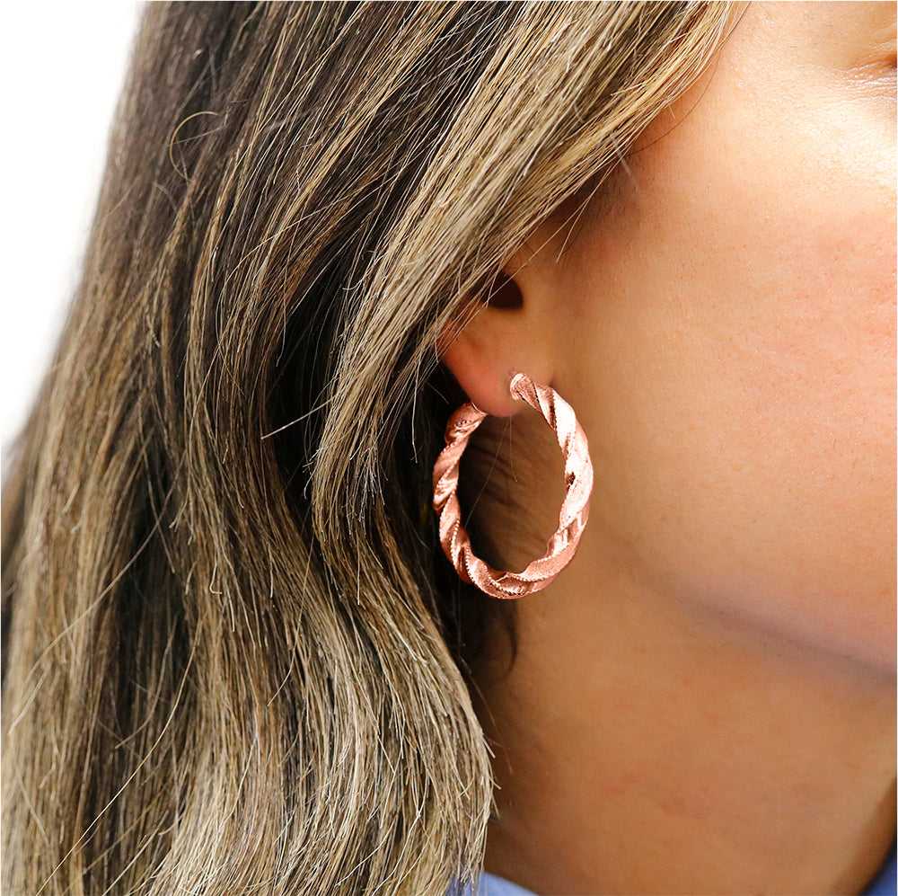 Rose Gold Sterling Silver Diamond Cut Twisted Hoops On Ear