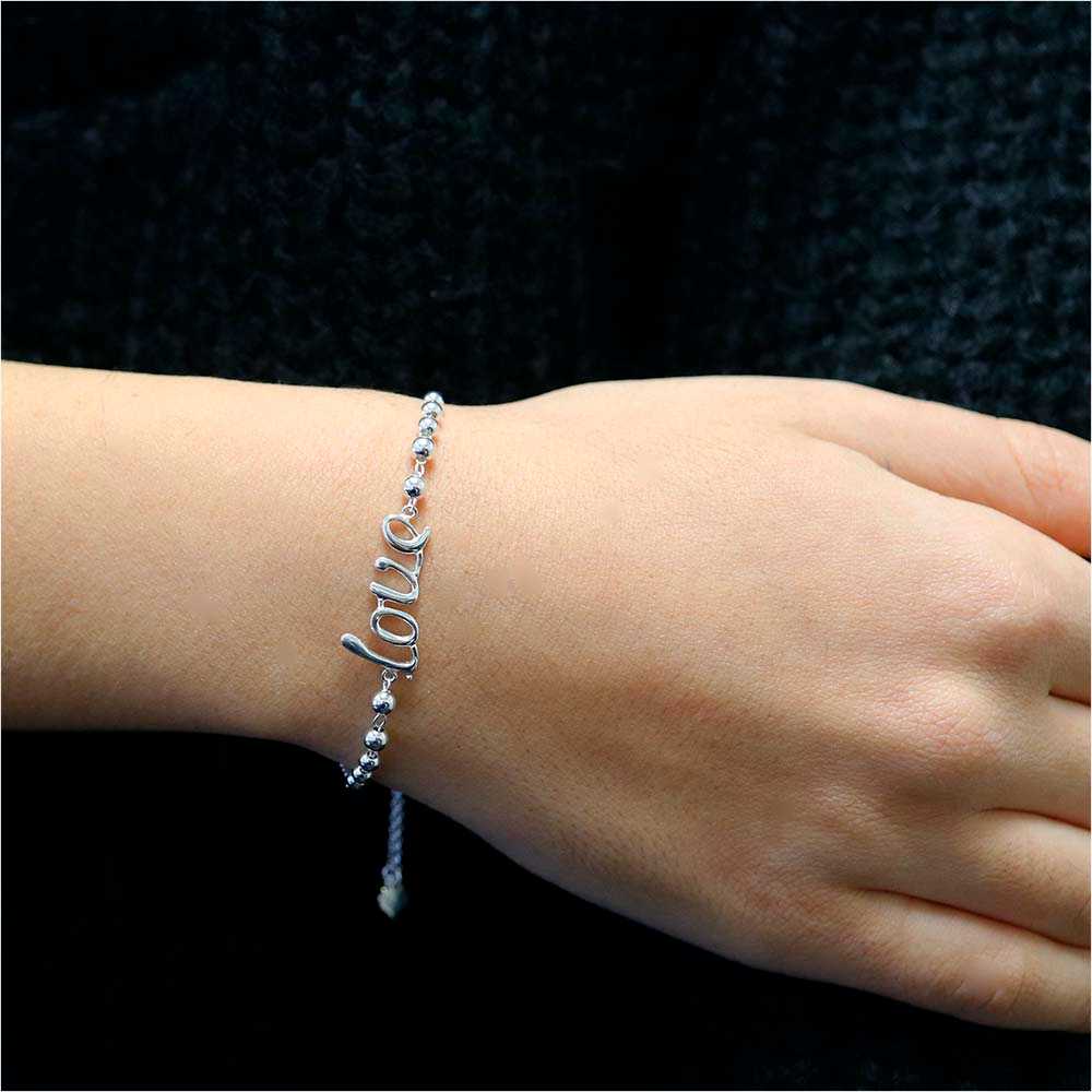 Silver Italian Sterling Silver Adjustable "Love" Bracelet On Wrist